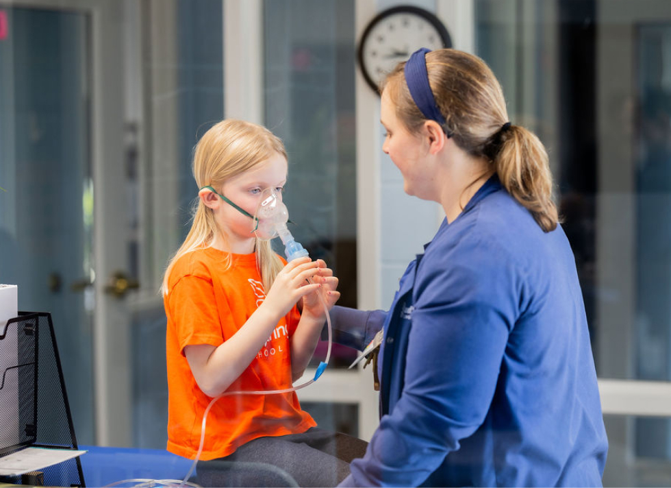 LeafSpring School Get Well Place nurse helping student